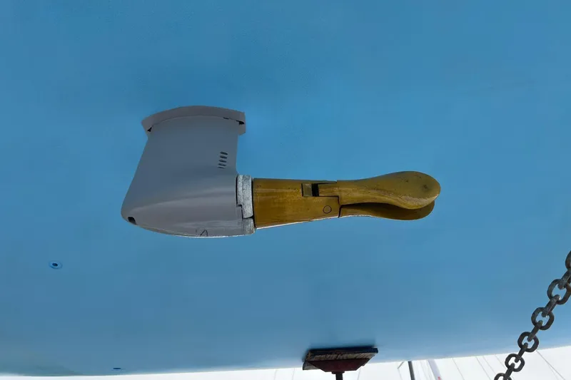 Slide: The Image of Close-up of a 2007 Class 40 Akilaria yacht rudder against a blue background. - 13