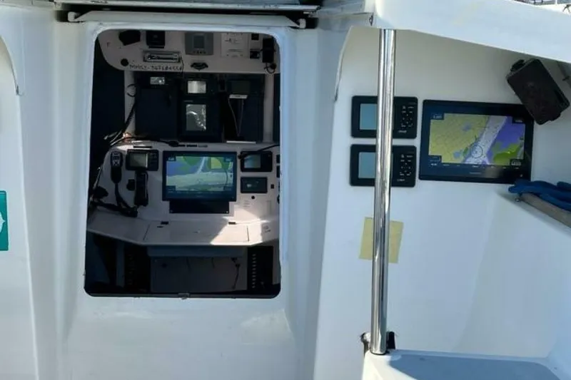 Slide: The Image of Cockpit of 2007 Class 40 Akilaria sailboat with navigation equipment and displays. - 2