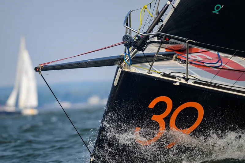 Slide: The Image of Sailing yacht Class 40 Akilaria 2007 cutting through waves, number 30 visible. - 9