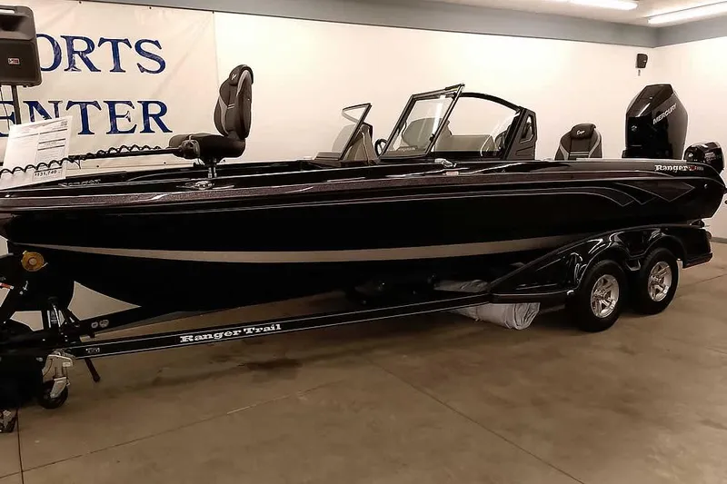 The Image of 2026 Ranger 622FS Pro boat on trailer in showroom setting. - 1