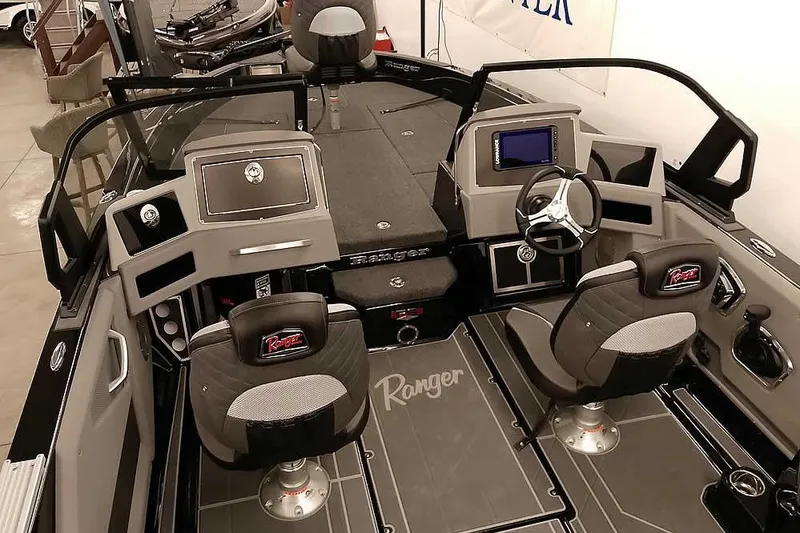 Slide: The Image of 2026 Ranger 622FS Pro boat interior with dual seats and modern dashboard. - 12