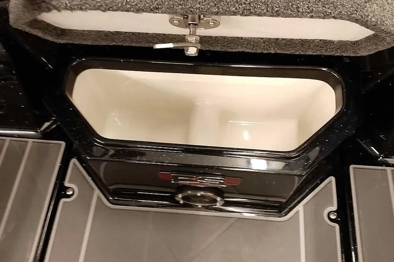 Slide: The Image of 2026 Ranger 622FS Pro boat storage compartment with open lid, showcasing interior design. - 13