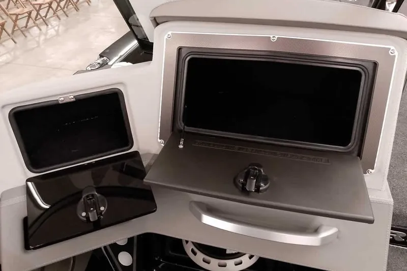 Slide: The Image of 2026 Ranger 622FS Pro boat storage compartments with sleek design and secure latches. - 25