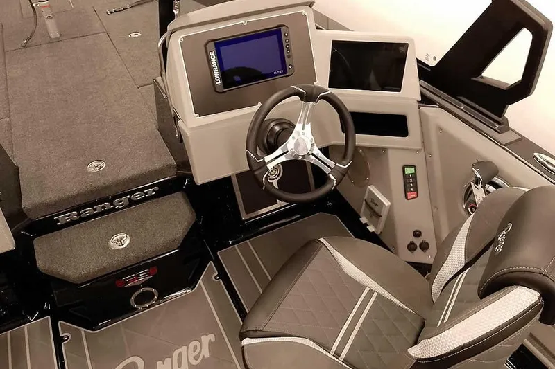 Slide: The Image of 2026 Ranger 622FS Pro boat interior with steering wheel and control panel. - 28