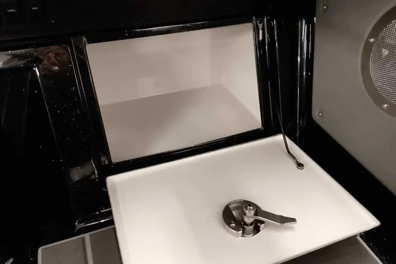 Slide: The Image of 2026 Ranger 622FS Pro interior compartment with latch and sleek design. - 29