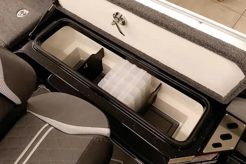Slide: The Image of 2026 Ranger 622FS Pro boat storage compartment with organized tackle boxes. - 35