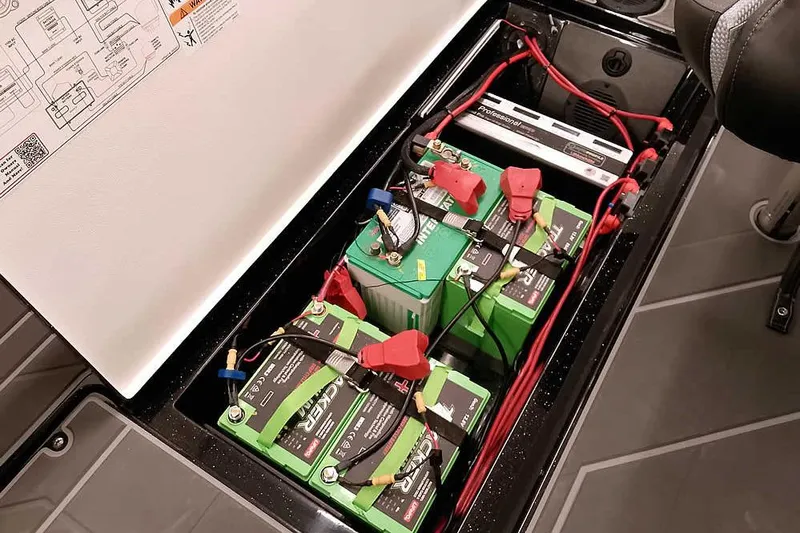 Slide: The Image of Battery compartment of 2026 Ranger 622FS Pro, featuring multiple green batteries and wiring. - 39