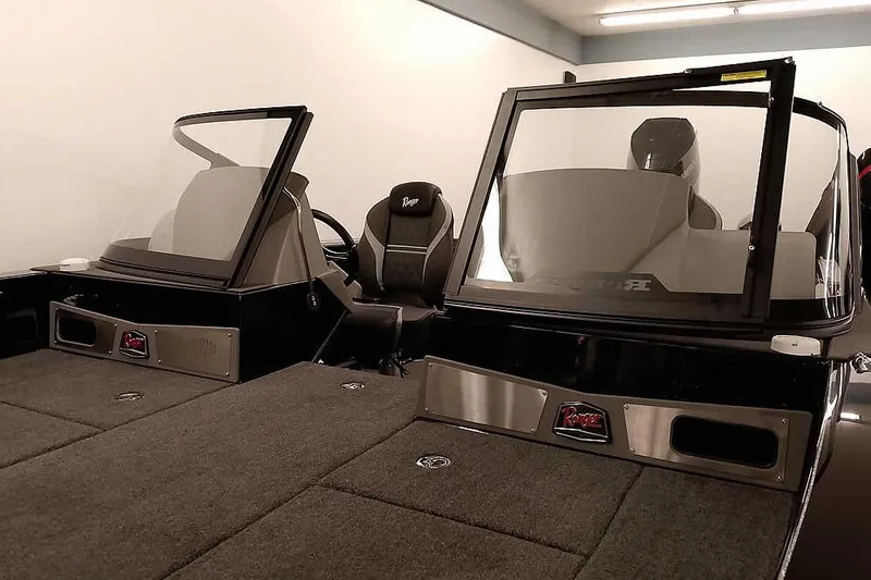 Slide: The Image of 2026 Ranger 622FS Pro boat interior with dual windshields and seating. - 9