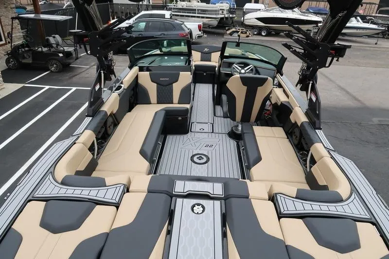 Slide: The Image of 2025 MasterCraft XT22 boat interior with luxurious seating and modern design. - 13