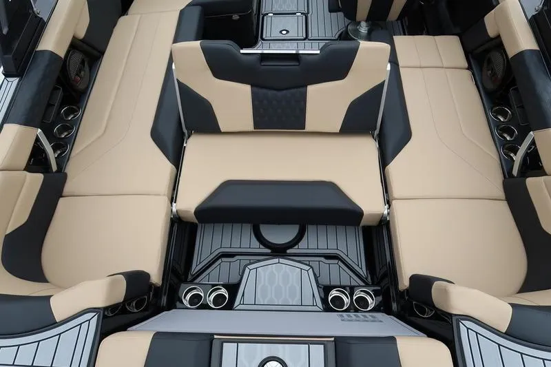 Slide: The Image of 2025 MasterCraft XT22 interior with beige and black seating, showcasing luxury and modern design. - 18