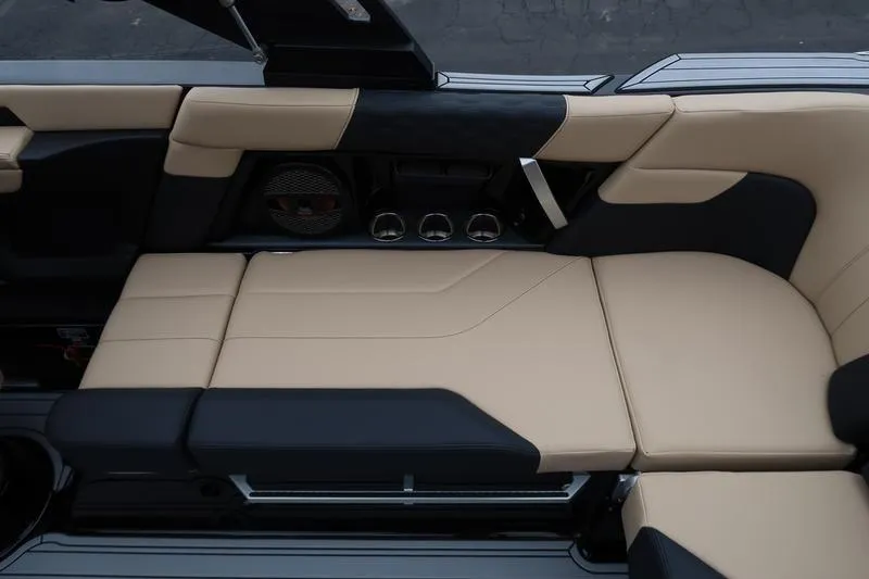 Slide: The Image of 2025 MasterCraft XT22 interior with beige and black seating, featuring modern design elements. - 20