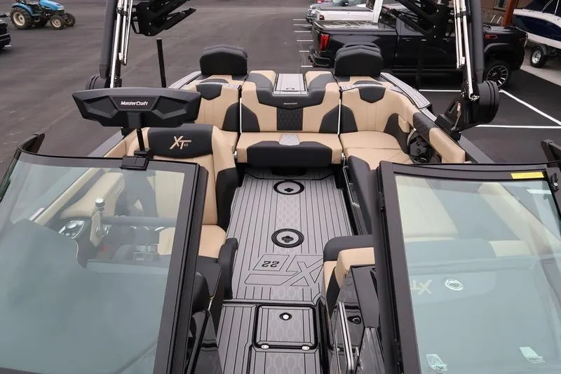 Slide: The Image of 2025 MasterCraft XT22 boat interior with luxurious seating and modern design. - 29