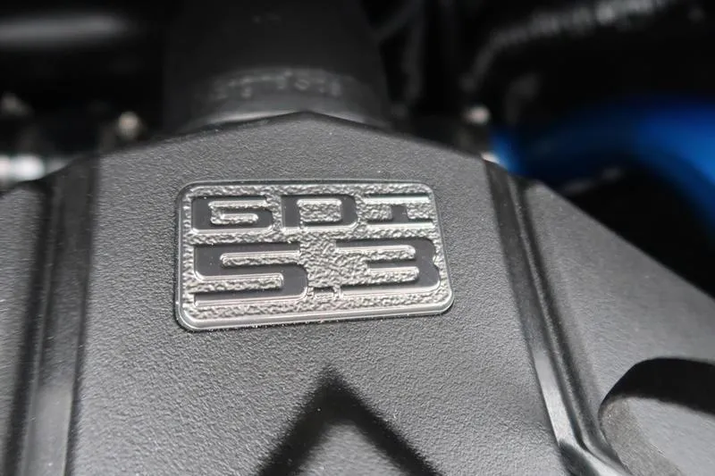 Slide: The Image of Close-up of GDI 5.3 engine badge on 2025 MasterCraft XT22. - 33