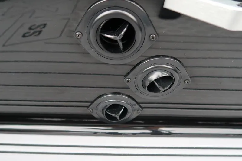 Slide: The Image of Close-up of 2025 MasterCraft XT22 boat exhaust ports. - 35