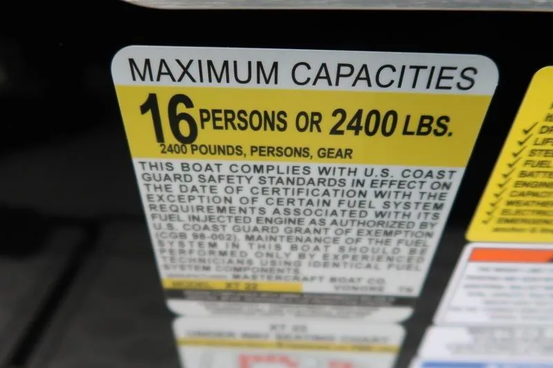 Slide: The Image of 2025 MasterCraft XT22 capacity label: 16 persons or 2400 lbs, U.S. Coast Guard compliant. - 36