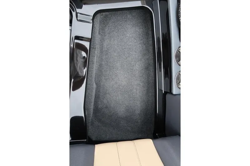 Slide: The Image of 2025 MasterCraft XT22 interior footwell with carpet and sleek design elements. - 45