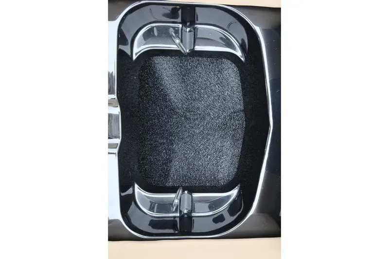 Slide: The Image of 2025 MasterCraft XT22 boat detail with sleek black and chrome design elements. - 47