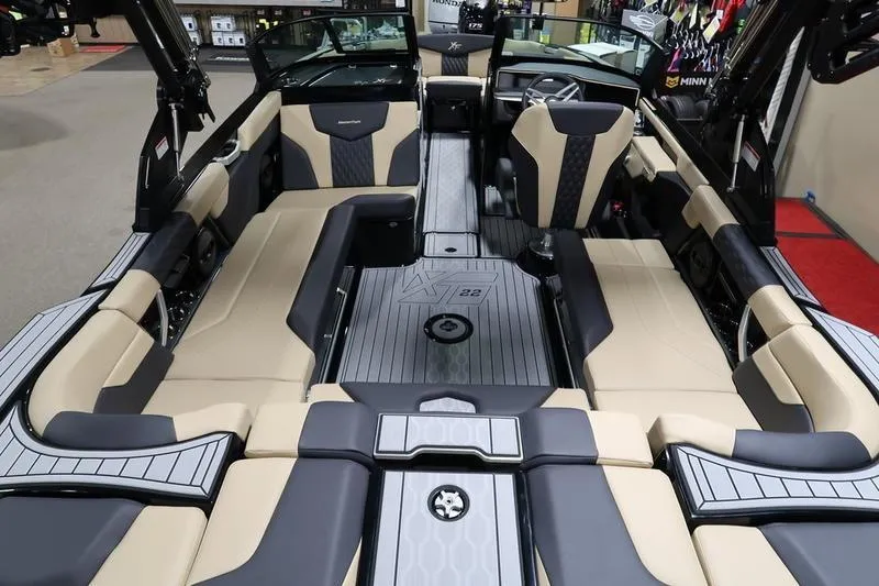 Slide: The Image of 2025 MasterCraft XT22 boat interior with luxurious seating and modern design. - 50