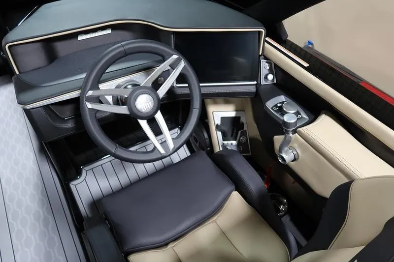 Slide: The Image of 2025 MasterCraft XT22 boat interior with modern steering wheel and dashboard controls. - 54