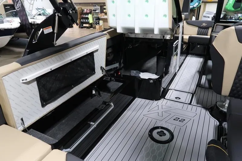 Slide: The Image of 2025 MasterCraft XT22 interior showcasing seating and storage compartments. - 55
