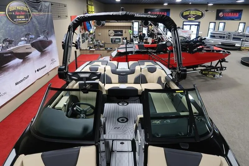 Slide: The Image of 2025 MasterCraft XT22 boat interior at showroom, featuring sleek design and modern amenities. - 63