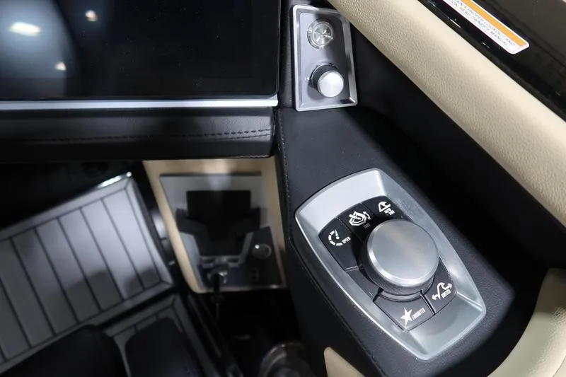 Slide: The Image of 2025 MasterCraft XT22 boat control panel with modern navigation features. - 64