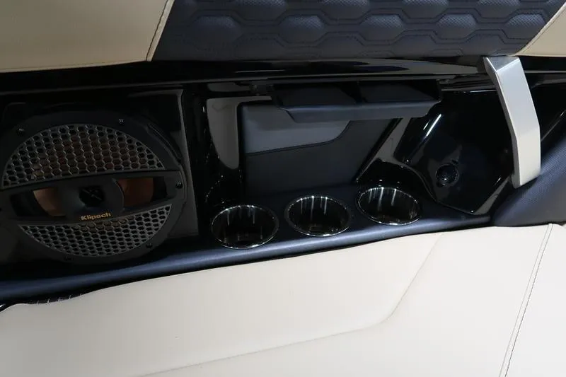 Slide: The Image of Interior of 2025 MasterCraft XT22 boat with speaker and cup holders. - 65