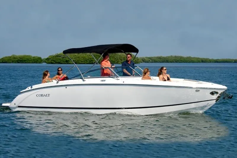 The Image of 2014 Cobalt R7 boat cruising on a sunny day with passengers onboard. - 1