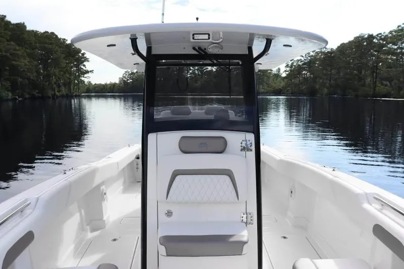 Slide: The Image of Manufacturer Provided Image: 2026 World Cat 280 CC-X boat on calm water, featuring sleek design and spacious deck. - 6