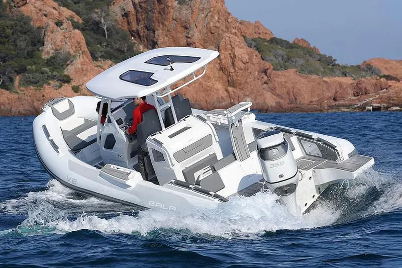 The Image of Manufacturer Provided Image: 2026 Gala V8 boat cruising on the sea near rocky coastline. - 1
