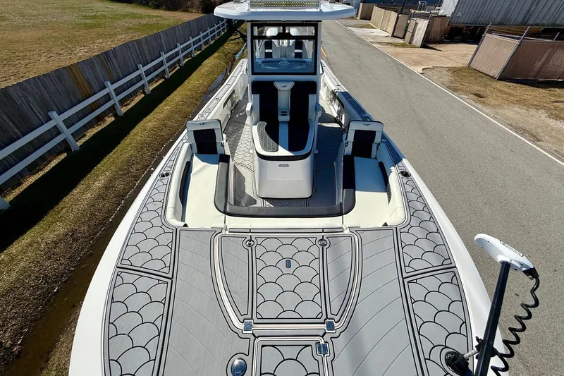 Slide: The Image of 2024 Tidewater 3100 Carolina Bay boat with sleek deck design and modern features. - 17
