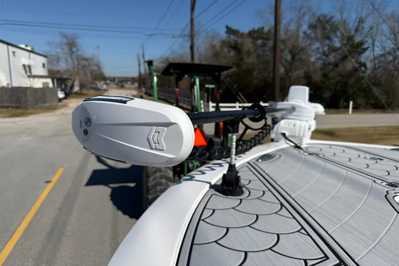 Slide: The Image of 2024 Tidewater 3100 Carolina Bay boat with advanced trolling motor on a road. - 19