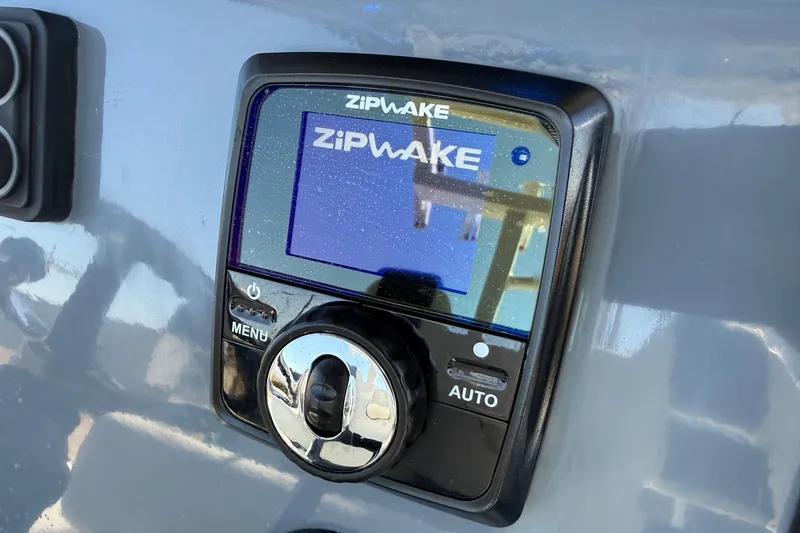 Slide: The Image of Zipwake control panel on 2024 Tidewater 3100 Carolina Bay boat dashboard. - 21