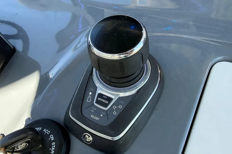 Slide: The Image of Joystick control on 2024 Tidewater 3100 Carolina Bay boat dashboard. - 22