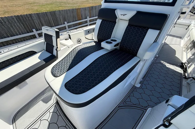 Slide: The Image of 2024 Tidewater 3100 Carolina Bay boat interior with stylish seating and modern design. - 24