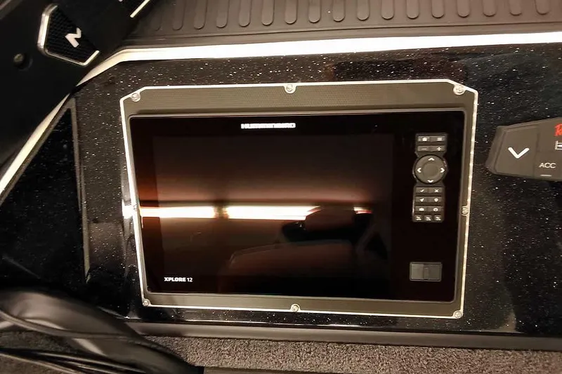 Slide: The Image of 2026 Ranger 620xFS Pro dashboard with Xplore 12 display and control panel. - 12
