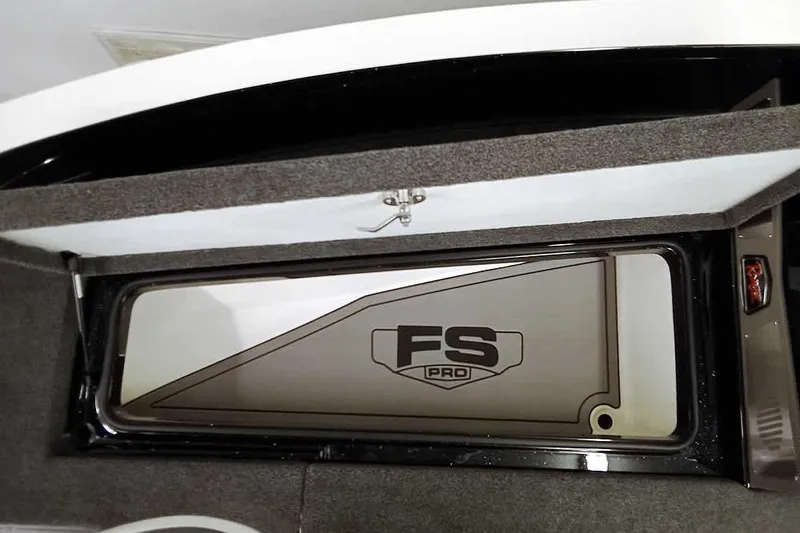 Slide: The Image of 2026 Ranger 620xFS Pro storage compartment with FS Pro logo, open lid view. - 14