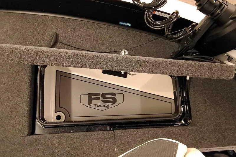 Slide: The Image of 2026 Ranger 620xFS Pro boat interior with FS Pro logo on storage compartment. - 15