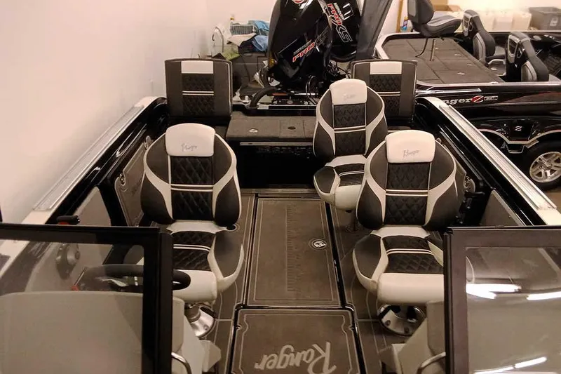 Slide: The Image of 2026 Ranger 620xFS Pro boat interior with stylish seating and modern design. - 17