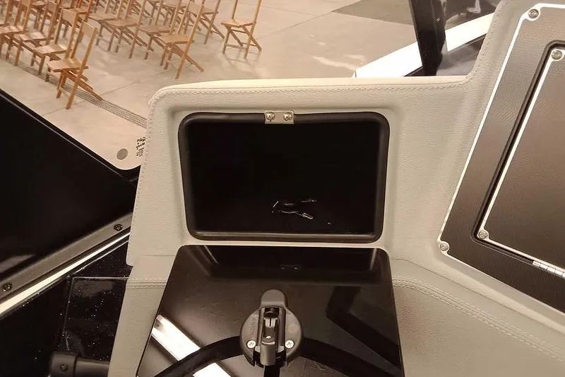 Slide: The Image of Interior of 2026 Ranger 620xFS Pro boat with open storage compartment. - 20