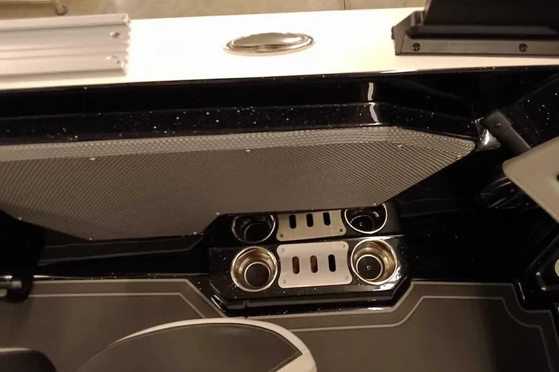 Slide: The Image of 2026 Ranger 620xFS Pro boat interior with cup holders and sleek design. - 23