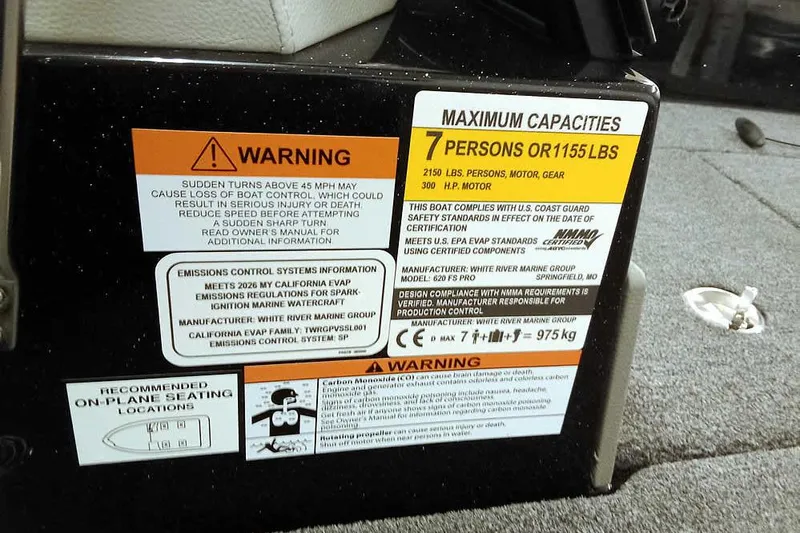 Slide: The Image of Warning and capacity labels on 2026 Ranger 620xFS Pro boat interior. - 24