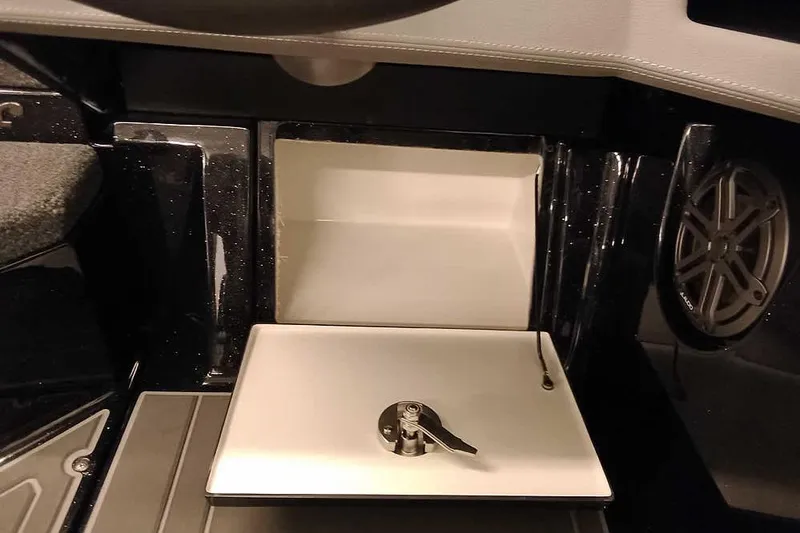 Slide: The Image of 2026 Ranger 620xFS Pro interior detail with storage compartment and speaker. - 29