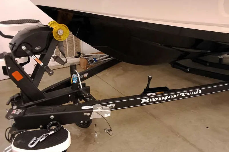 Slide: The Image of 2026 Ranger 620xFS Pro boat trailer in a garage setting. - 4