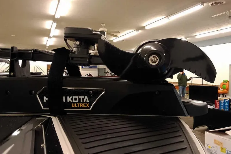 Slide: The Image of 2026 Ranger 620xFS Pro with Minn Kota Ultrex trolling motor in showroom. - 6