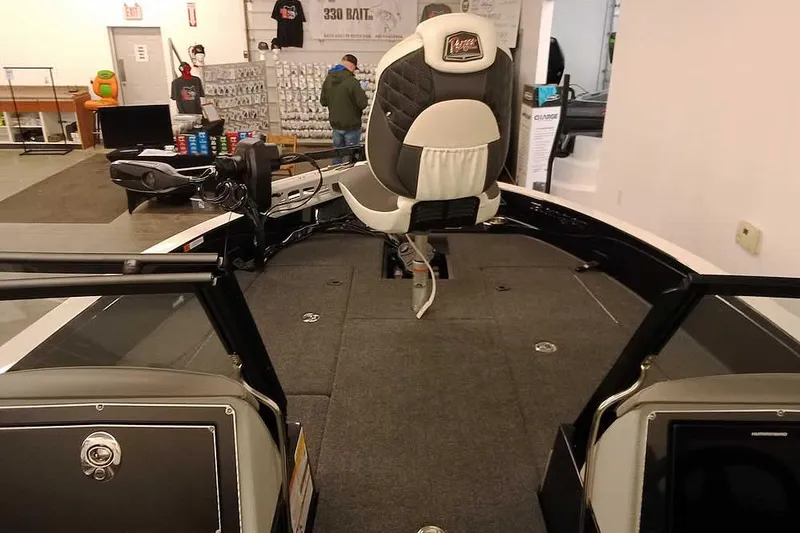 Slide: The Image of 2026 Ranger 620xFS Pro boat interior with seating and fishing equipment. - 8