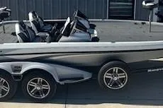 Slide: The Image of 2023 Ranger Z520R boat with sleek design and modern features, parked outdoors. - 3