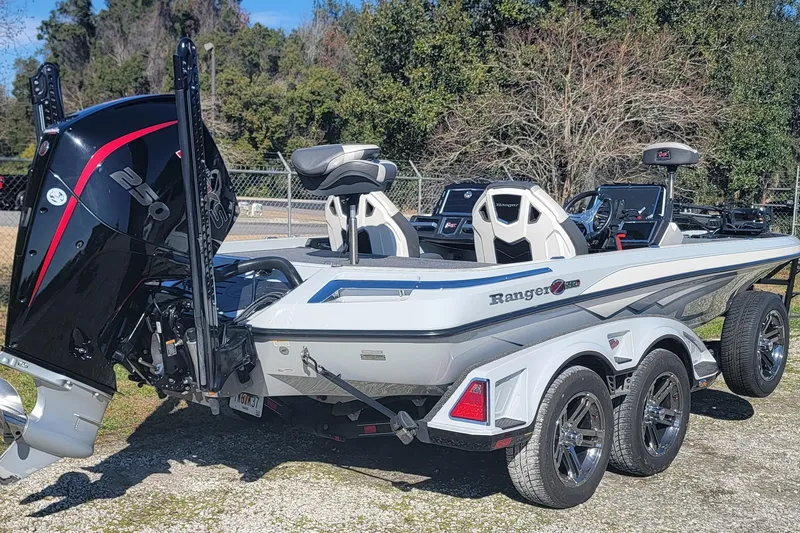 Slide: The Image of 2023 Ranger Z520R boat with powerful engine, sleek design, and dual-axle trailer. - 5