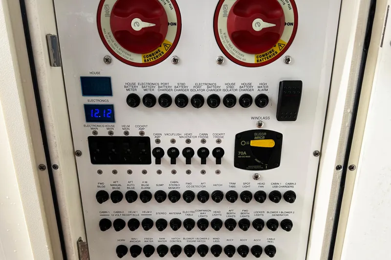 Slide: The Image of Control panel of a 2014 Pursuit SC 365i Sport Coupe with various switches and meters. - 13