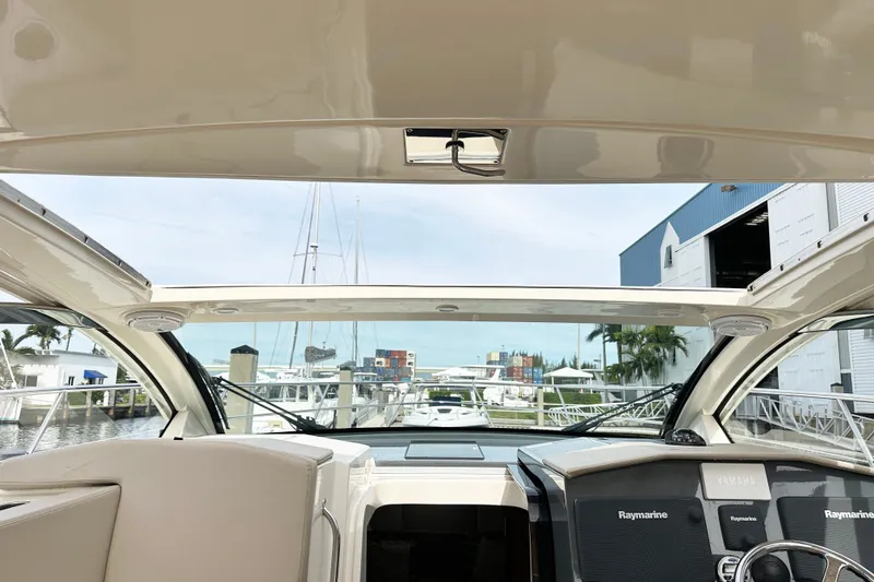 Slide: The Image of Interior view of 2014 Pursuit SC 365i Sport Coupe yacht at marina. - 14